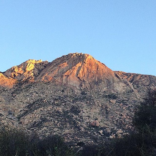 El Cajon Mountain catching San Diego's early morning light. The main face has impressive multi pitch climbs up to 400+ feet.  Most climbs are protected by bolts with very few "trad" lines. A +|- 1hr hike makes a great warm up approach. Great SoCal "winter" climbing