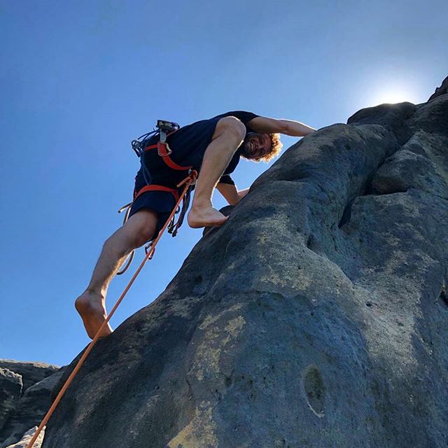 This summer we had the absolute pleasure to experience climbing at 'Elbsandsteingebirge' in Eastern Germany. Matt and I were psyched to link up with master climber @robert.leistner who showed us around his home crag by the German/Czech border. In many ways climbing is unique there. The old traditions are taken very serious in Elbsandstein. This includes no metal "trad" protection allowed, such as stoppers, cams, etc (to avoid damage to the soft sandstone). Instead, different diameter of rope pieces for different sized cracks are used and tied into a sling with a knot (usually just an overhand or a figure 8) to then be 'stuffed' and 'jammed' into the cracks for protection. On a closer look you can see a stick on a carabiner on Robert's rack for setting, adjusting and removing placements (which, compared to removing cams turns out quite tricky when following). Despite the many obligatory "trad"/knot placements, there are a few bolts on many routes which are often run out and by most people considered scary leads.Other ethics include no chalk and historic free ascents were totally valid as a team effort. Climbing on the shoulders, hips, or thighs of your team member's bodies to reach a hold or enter a crack system is totally legit and considered a free ascent. See the vintage b/w pics from one of the many official climbing clubs that still play a significant role in maintaining the traditional climbing ethics. Most towers have rappelling options with probably the fattest bolts and rings I have seen outdoors (rappelling off one bolt/ring is standard). Summit registers are part of the climbing experience because only free standing towers (providing quite the summit experience) are legally open for climbing.Despite the absolute excitement to finally get to climb at this unique place, our day was mellow and relaxing! A heat wave had just hit Germany and scorching temperatures at over 100 degrees let us focus on other beautiful things such us bathing in the river and eating ice cream in the village nearby.Thanks to Robert's motivation and general passion to show us the area, we still managed to gear up for 3 pitches.